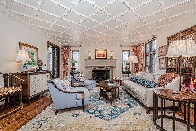 living room with dark wood-type flooring and a wealth of natural light