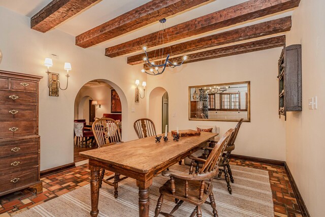 dining room with beam ceiling