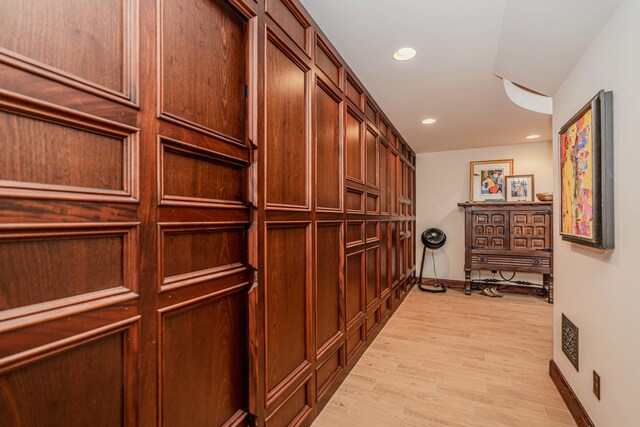 hall with light hardwood / wood-style floors