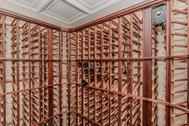 wine room featuring ornamental molding