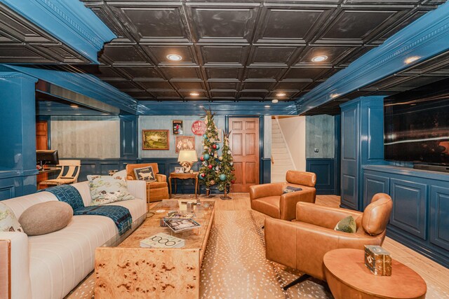 home theater room with decorative columns and coffered ceiling