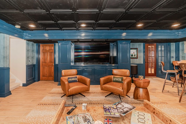 cinema room with light hardwood / wood-style floors