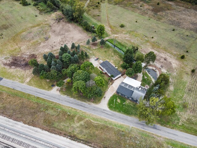 birds eye view of property with a rural view