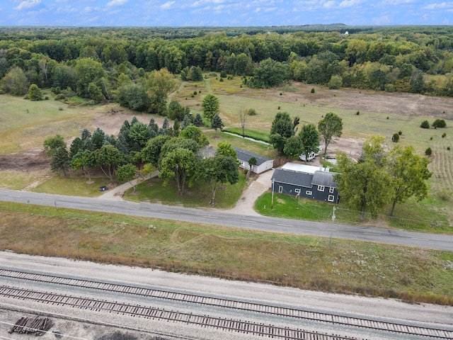 birds eye view of property with a rural view