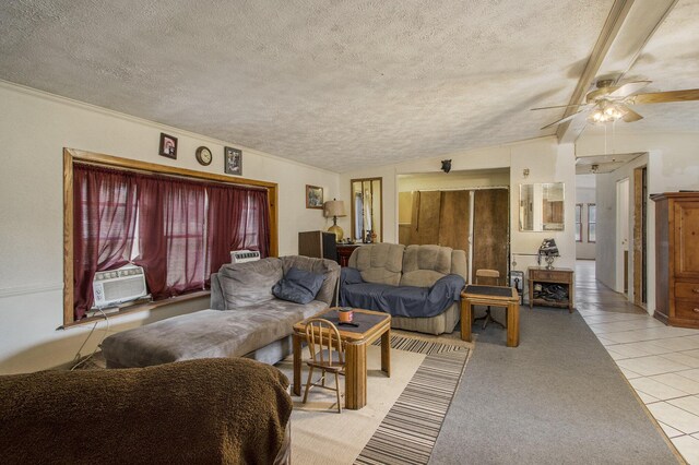 tiled living room with ceiling fan, cooling unit, and a textured ceiling