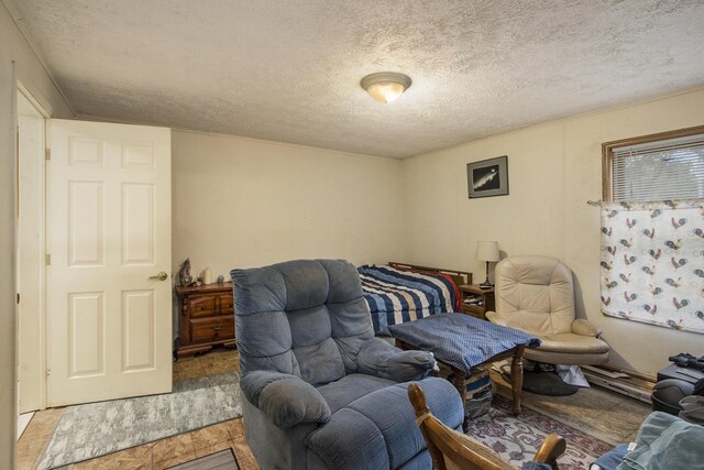 bedroom with a textured ceiling and hardwood / wood-style flooring