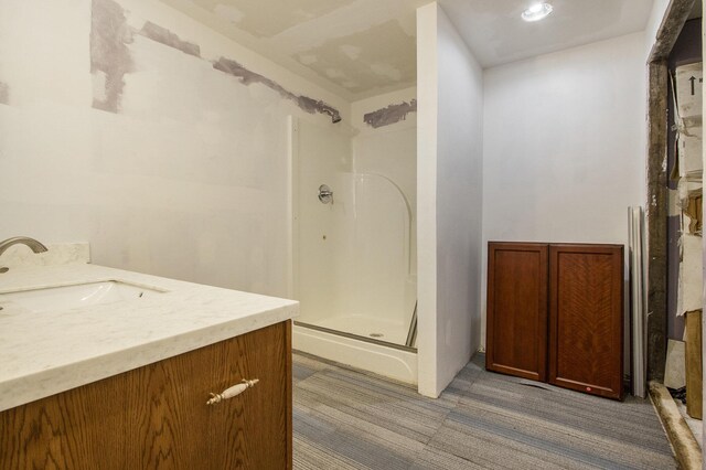 bathroom with vanity and an enclosed shower