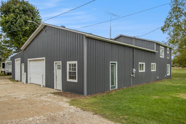 garage featuring a yard