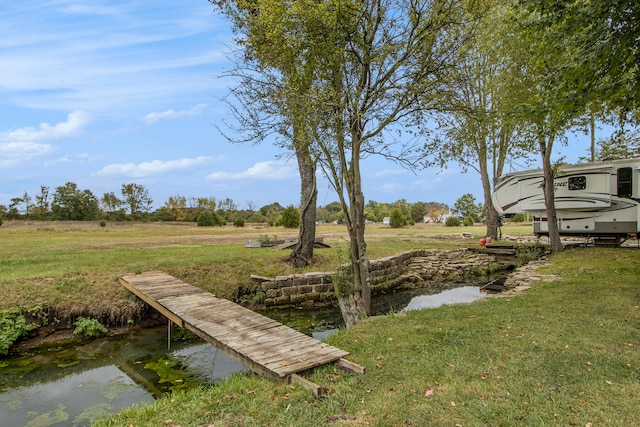 view of yard featuring a dock