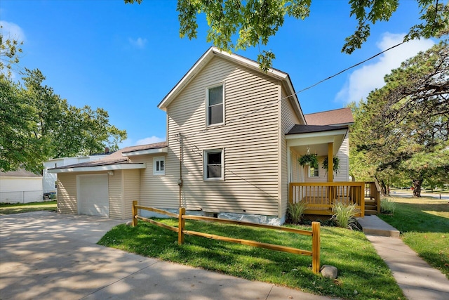 view of home's exterior featuring a garage and a yard