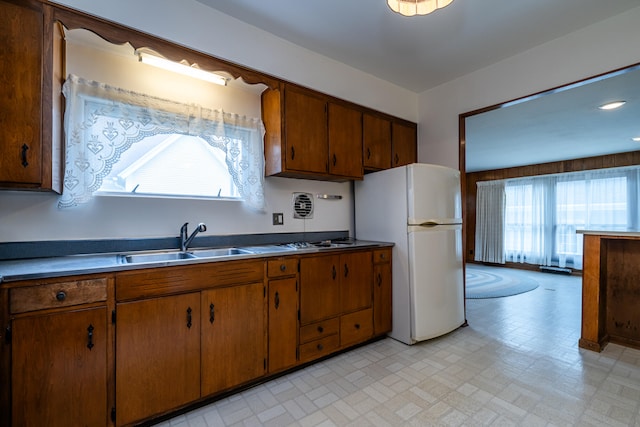 kitchen with white refrigerator and sink