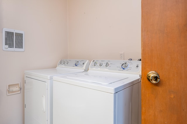 washroom featuring washer and dryer