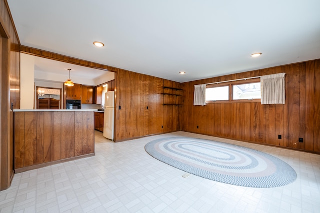 interior space featuring wooden walls