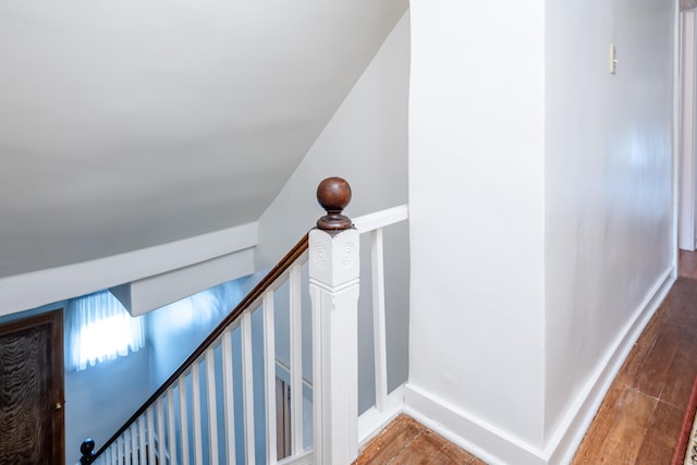 stairs featuring wood-type flooring