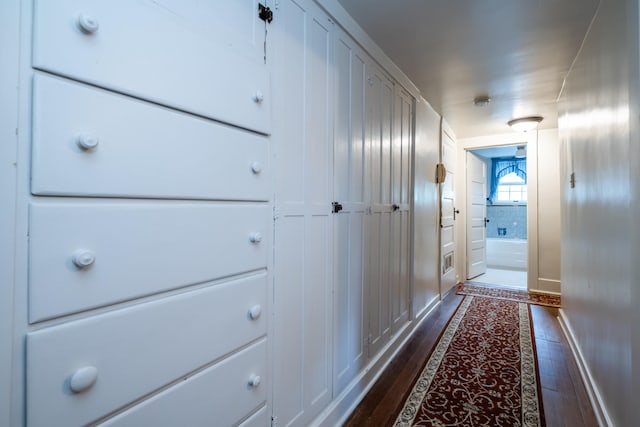 hall with dark hardwood / wood-style flooring