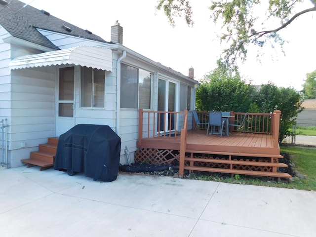 back of house featuring a patio area and a deck