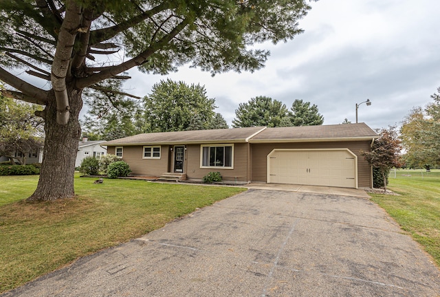 ranch-style home with a garage and a front yard