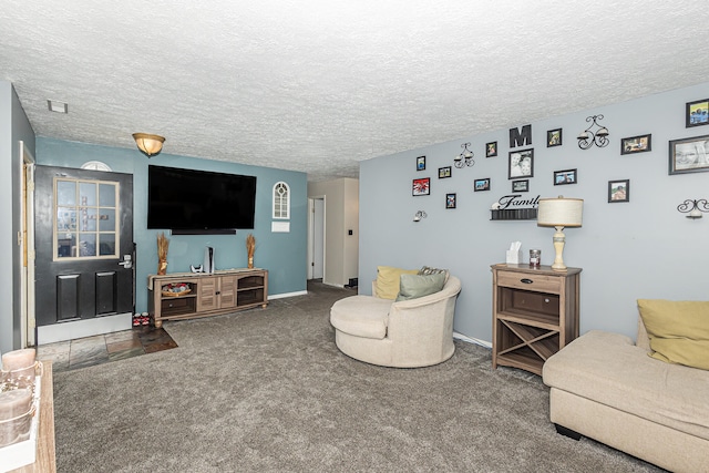 carpeted living room featuring a textured ceiling