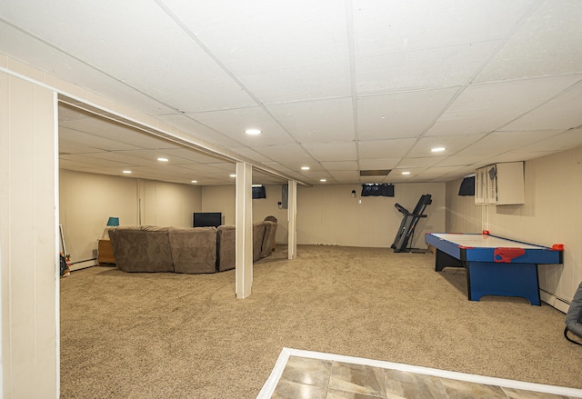 playroom with a drop ceiling, a baseboard radiator, and carpet flooring