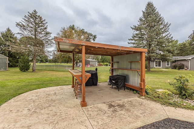 view of patio featuring a storage unit