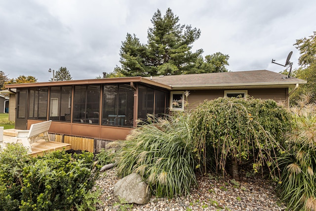 rear view of house with a sunroom