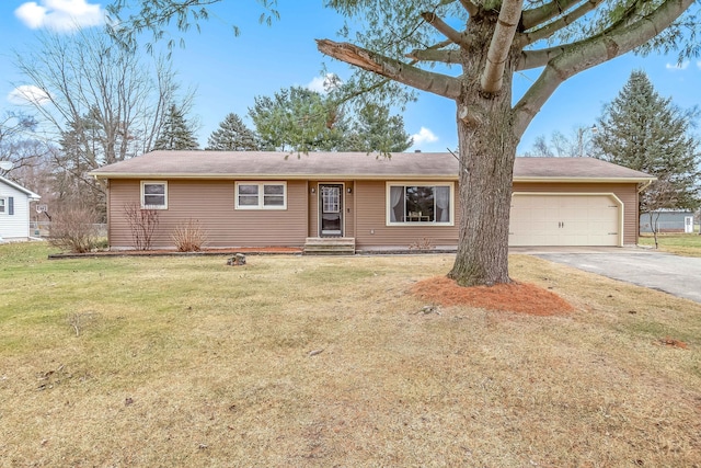 ranch-style house with a garage and a front lawn