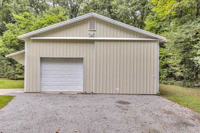 garage featuring wooden walls