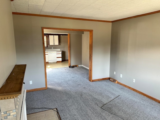 carpeted spare room with crown molding