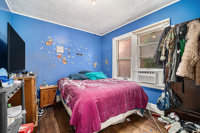 bedroom featuring a textured ceiling and dark hardwood / wood-style floors