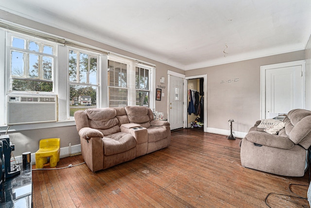 living room with cooling unit, hardwood / wood-style flooring, and crown molding