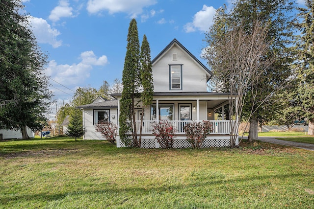 3143 US 31 N, Conway, MI 49722 - view of front of home featuring a front lawn and a porch