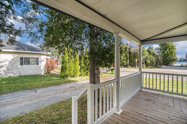 3143 US 31 N, Conway, MI 49722 - deck featuring a porch and a lawn