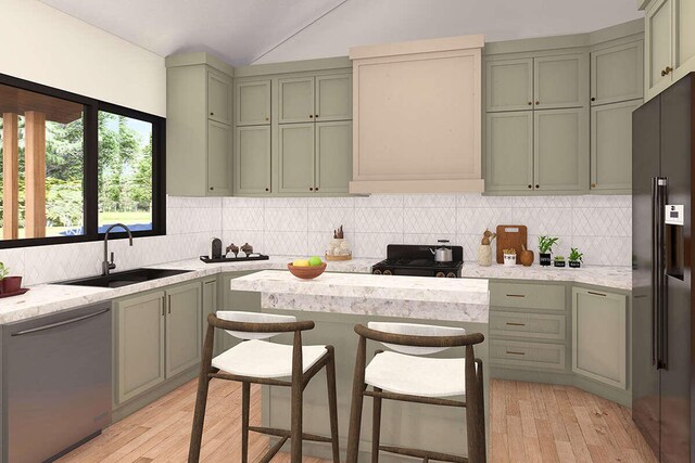 kitchen featuring stainless steel appliances, light hardwood / wood-style floors, green cabinetry, and sink