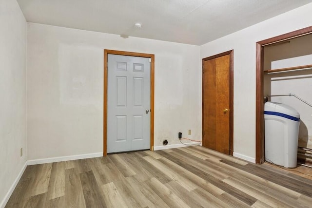 unfurnished bedroom with light hardwood / wood-style floors