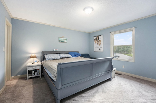 carpeted bedroom with ornamental molding and a textured ceiling