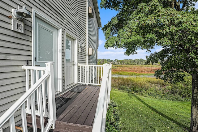 wooden terrace with a yard