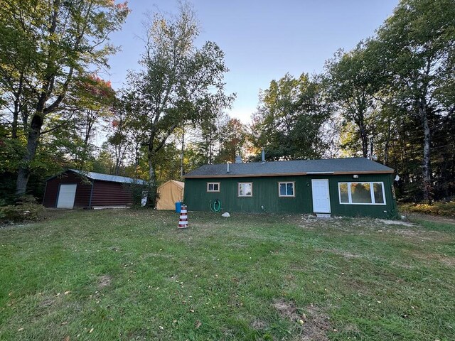 exterior space with a front lawn and a shed