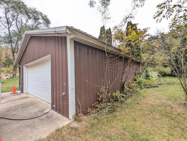 garage featuring a lawn