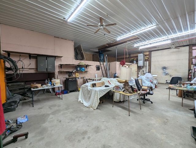 garage featuring a workshop area and ceiling fan