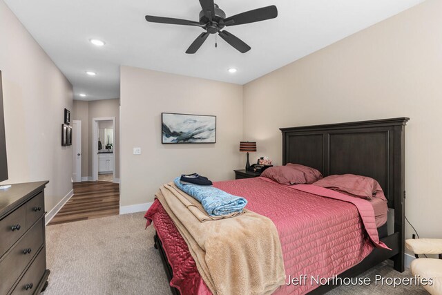 bedroom featuring ceiling fan and light colored carpet