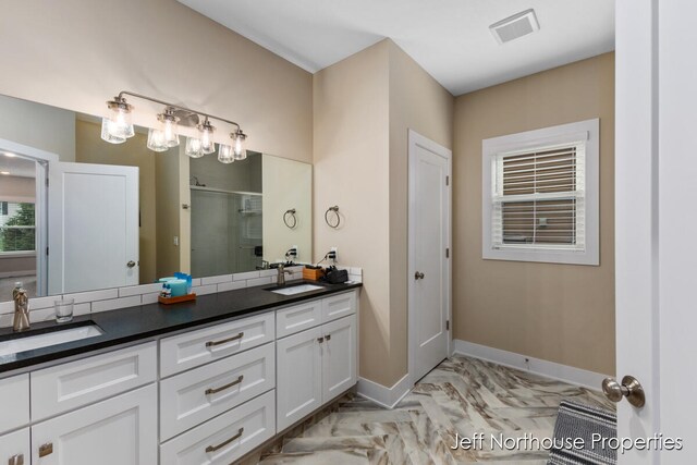 bathroom with vanity and an enclosed shower