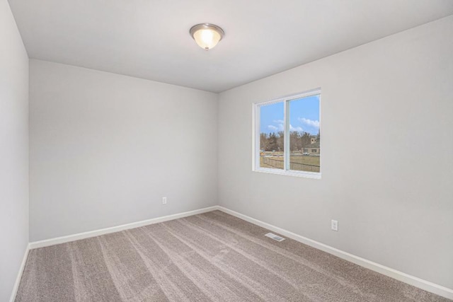 unfurnished room with carpet floors