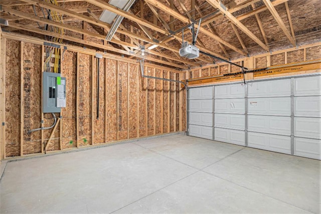 garage featuring electric panel and a garage door opener