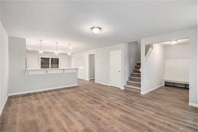 unfurnished living room with dark hardwood / wood-style floors