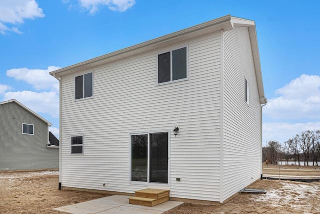 back of house with a patio