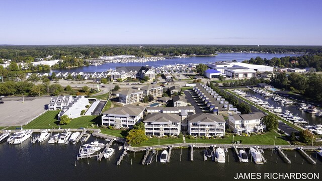 birds eye view of property featuring a water view