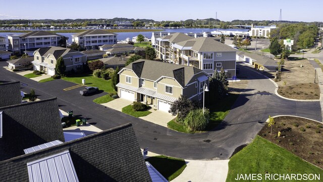 birds eye view of property featuring a water view