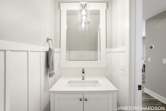 bathroom featuring vanity and hardwood / wood-style floors