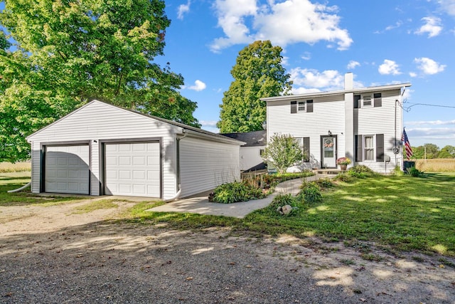 view of front of house with a garage and a front yard