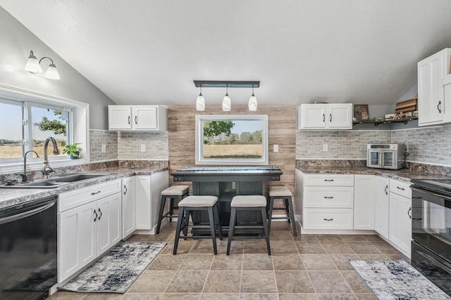 kitchen with white cabinetry, sink, tasteful backsplash, vaulted ceiling, and black appliances